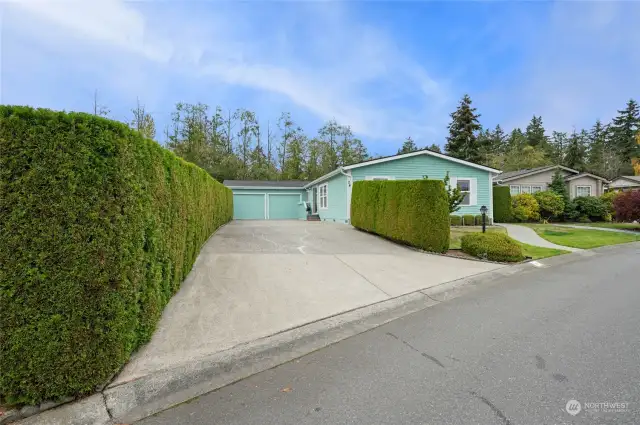 Welcome Home! With a large driveway and attached garage, parking  is not an issue!