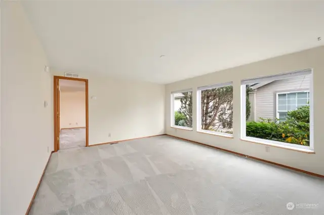 A large living room with abundant natural light.