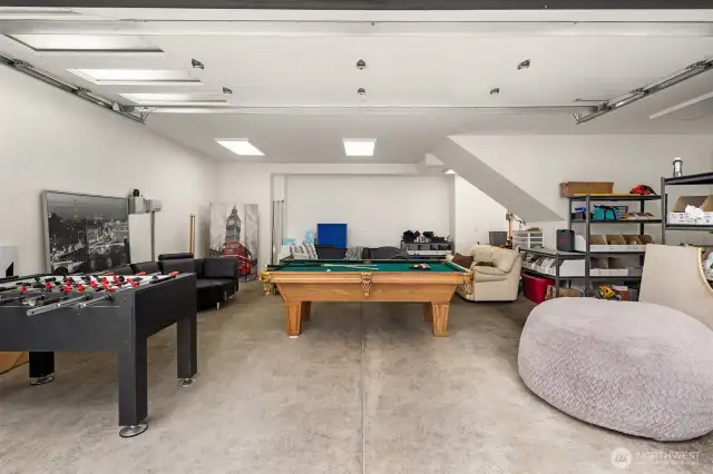 Car enthusiasts and outdoor adventurers will be thrilled by the 10-car garage space, complete with RV parking and ample space for all your recreational gear. Whether you collect cars, boats, or simply need a place for your projects and storage, you have room for everything!  This is one of the three garages below the ADU. Endless opportunities for play, storage or cars!