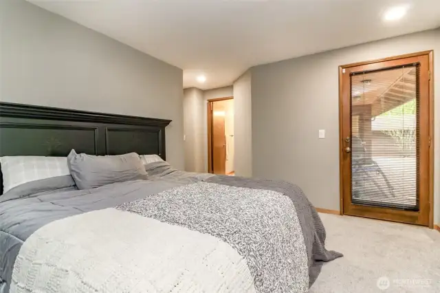 Primary bedroom leads to the back deck