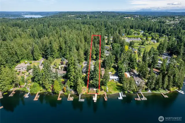 Great view of the 1.85 acres.  Imagine having a 1,000 ft long meandering, paved, driveway through the forest.  Feels like you're on your way to a retreat in the woods when you come home.  On the other side (north) of 20th, about a block to the east, is an entrance to Big Rock Park...features walking trails, gardens, a tree house and more.