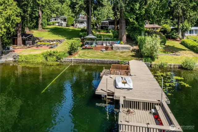 Another great view of the dock, the clear water, Shade Garden and the party barge.
