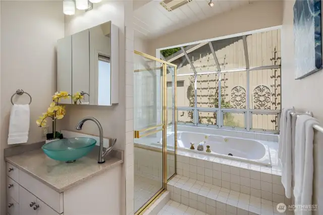 Primary ensuite bath with jetted soaking tub, and separate shower.