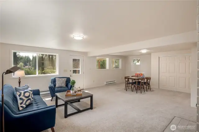 Another view of the downstairs rec room...and bedroom.  There is a murphy bed adjacent to the closet you see on the far-right wall.   It has a nice view of Pine Lake too.