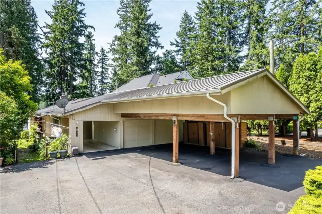 The owner added this carport and built it with the idea of having it support a second story addition someday.   Though the septic for the main house is rated for 3 bedrooms, the owners paid to have the sewer line stubbed for future connection on the main road.  So there is sewer is available to the property if you want to expand the main house.  There are 6 covered places to park...2 in the garage/shop (best for storing those vintage cars you only get out for special occasions), 3 under the carport addition, and 1 in the original carport.  The carport addition was build to support a second story addition.   The property is stubbed for sewer...in case you plan to add bedrooms.