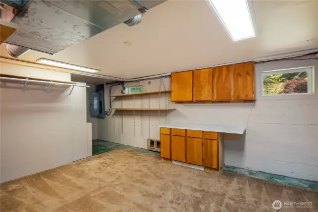 Unfinished basement area...hobby room, indoor shop, media room?  Great storage too.