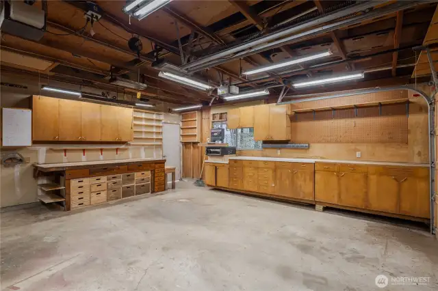 This is the inside of the garage.  It was used for woodworking by the current owners...could also be a great place to store those vintage cars.   In addition to the 2-car garage, there are 4 covered spaces under the carports.