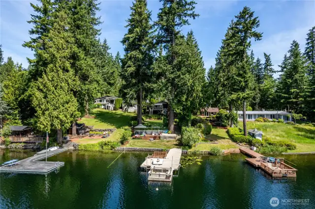 View from the lake looking back at the "shade garden".   The Shade Garden has been a gathering place for the owners, their guests and family for generations.