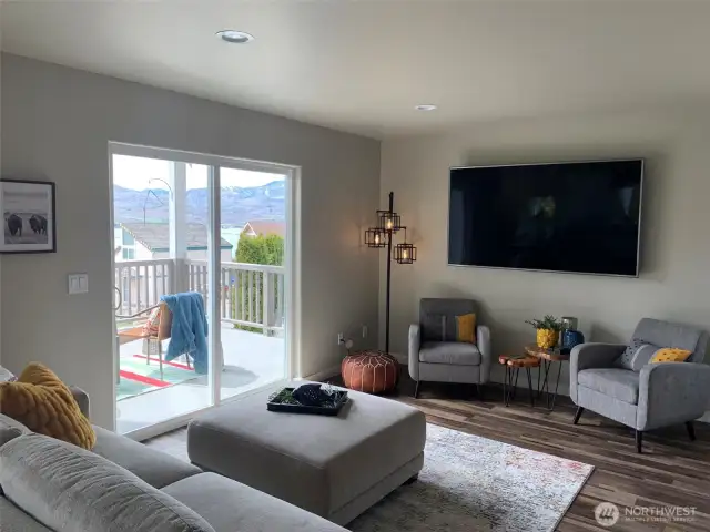 Patio doors lead to covered deck