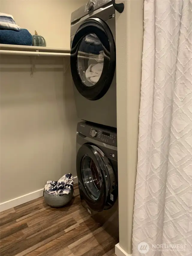 Laundry conveniently located in master closet