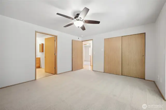 Primary bedroom with ceiling fan