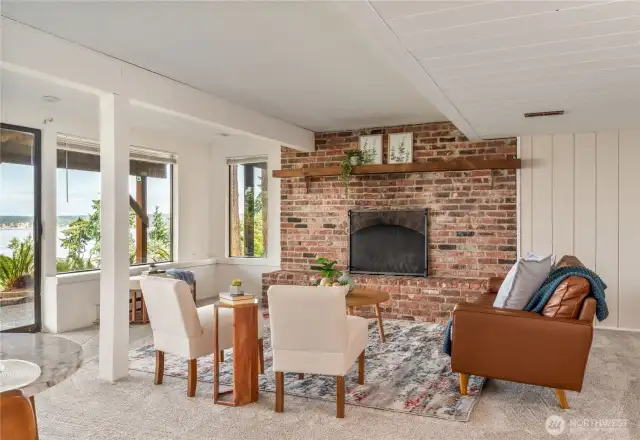 Wood fireplace in lower level living space.