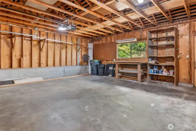 Two car garage with workbench.
