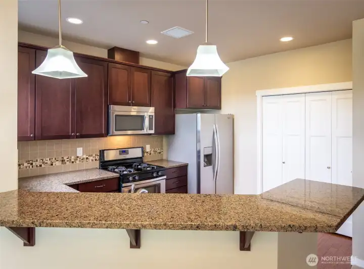 The handy counter height bar top makes it easy to serve food to guests!