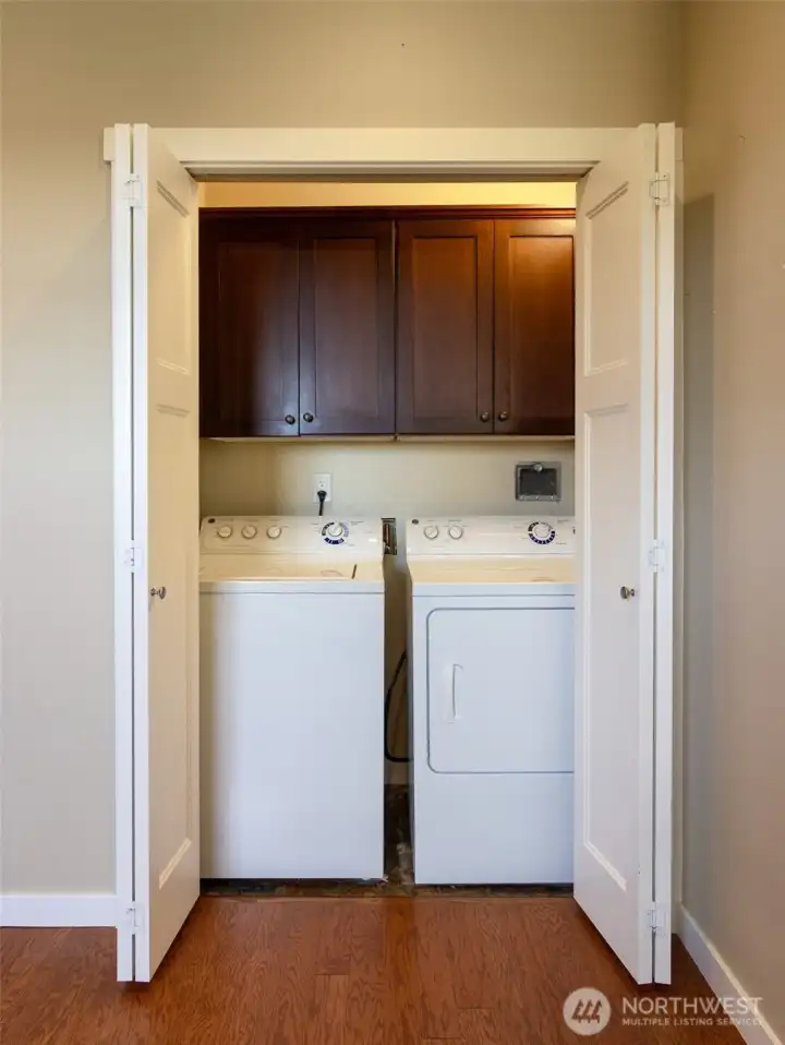 The laundry closet is conveniently located just off the kitchen.