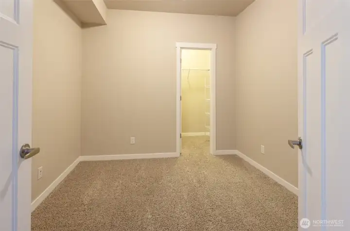 The second bedroom is spacious and has a walk-in closet!