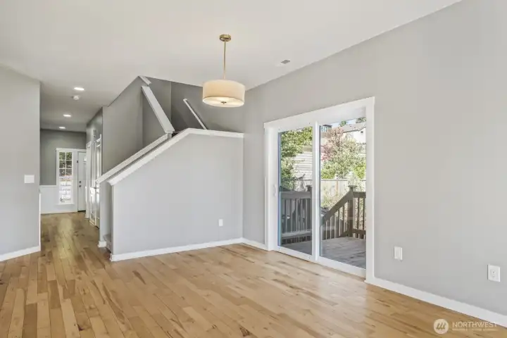 Newly added sliding door opens to a spacious deck with direct access to the fenced turf backyard and a charming wild fruit orchard featuring cherry trees, apples, pears, and more.