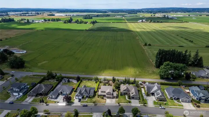 Overlooking lush farmlands behind the home