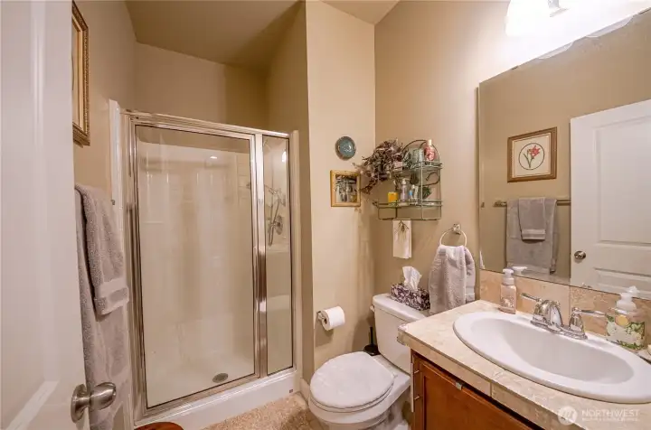 The 3/4 guest bathroom is located right next to the downstairs bedroom.