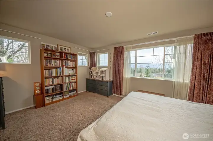 Looks at all those windows! Since the unit is on the corner, extra windows were added,  letting in more sunshine to beautifully brighten the space.