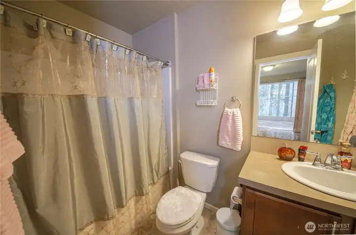 The upstairs guest room ensuite bathroom is full size.