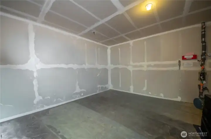 With the help of some digital magic, we "removed" the stuff in storage to help give an idea of the space. It addition to storage, this can be converted into a sizable workshop area.