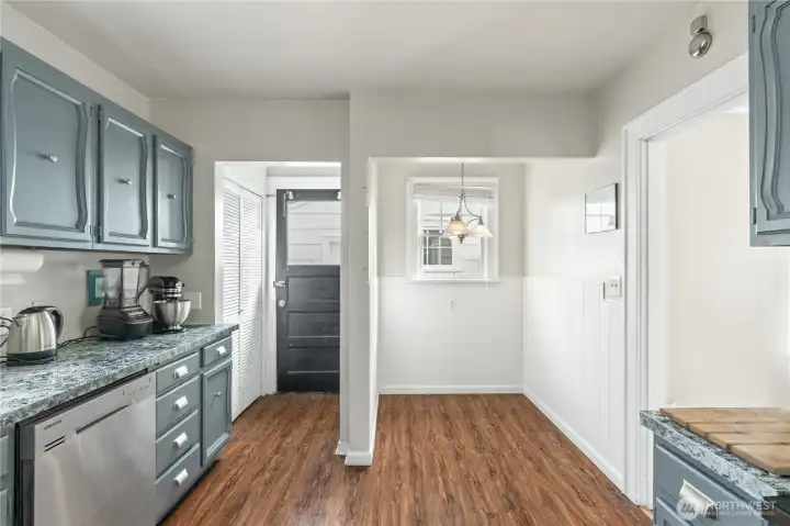 Breakfast nook off of kitchen and door to outside