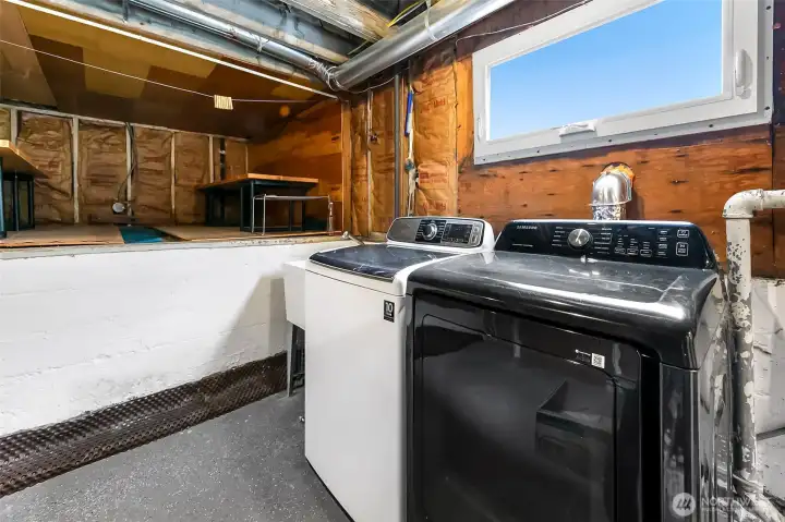 Utility room with great storage and utility sink. Washer and dryer are included in the sale.