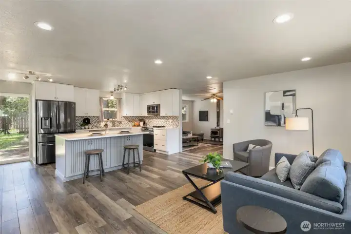 Enter the space into the seamless open kitchen and living room.