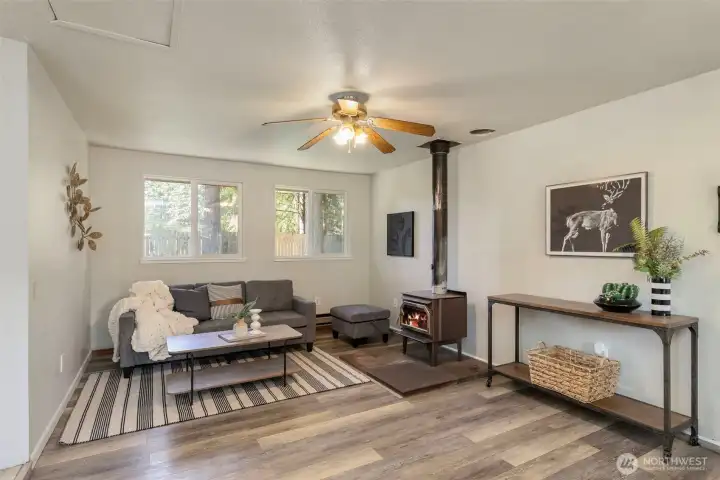 Woodstove with venting that connects to the bedroom hallway.