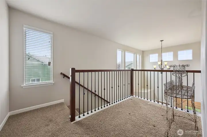Open stair case with gleaming rod iron!