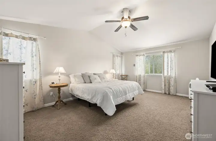 Light and bright master suite with vaulted ceilings.