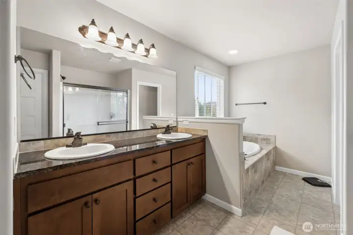 Large master bath w/ slab granite, double sinks, soaking tub and huge walk-in closet!