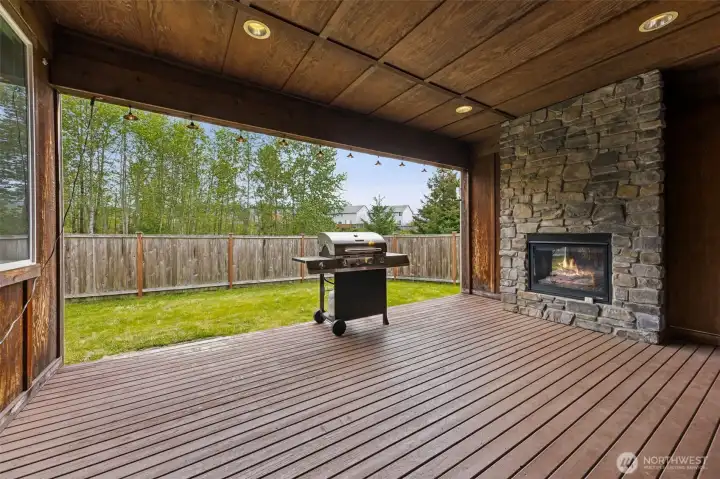 Cozy outdoor retreat w/  gas stone fireplace.
