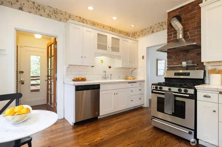 Ample cabinets and counter space on both sides of the kitchen