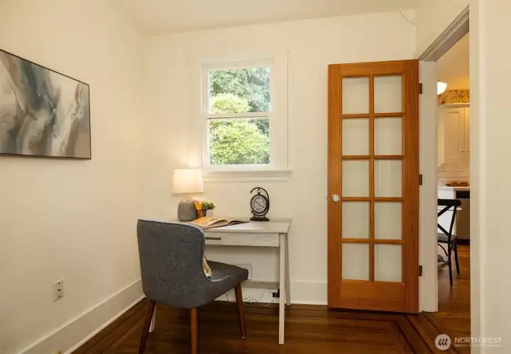 Adjacent to the kitchen is a sunny area for browsing recipes or a handy homework area