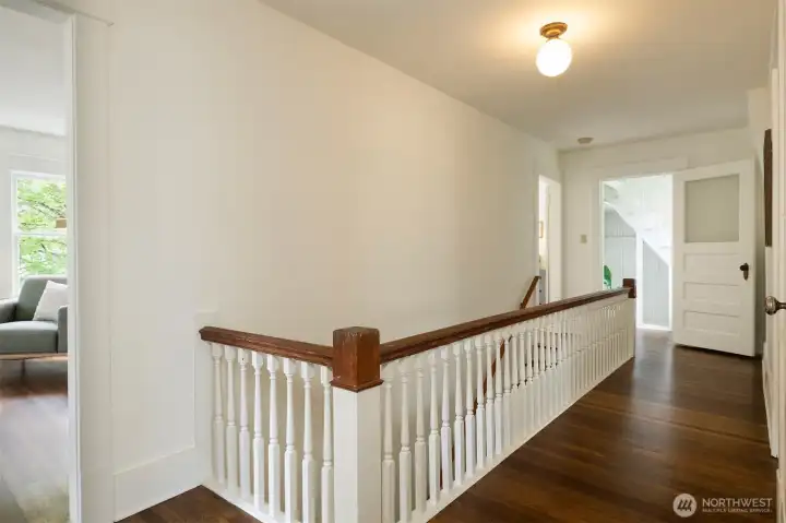The hallway on the second floor opens into each of the 4 bedrooms