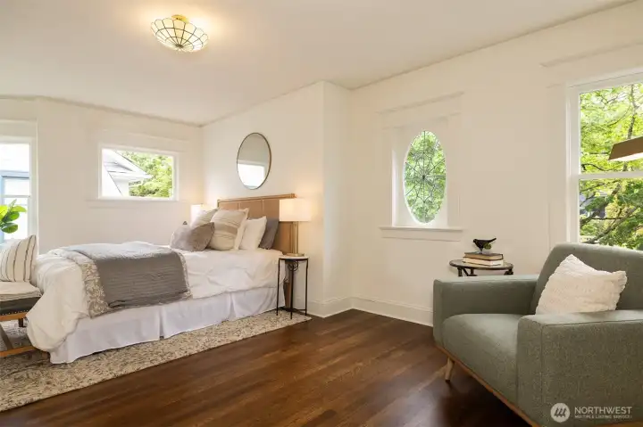 The massive primary bedroom holds plenty of space for relaxing and also for a future addition of a primary bathroom