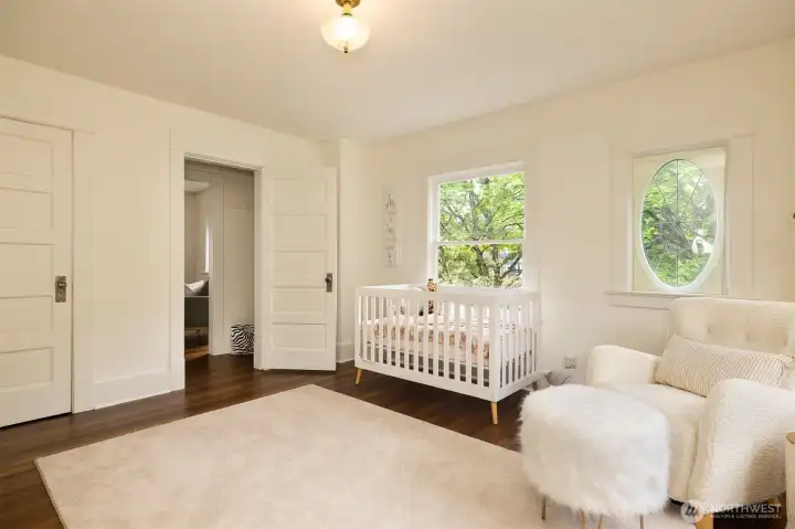 The second large  bedroom, staged as a nursery