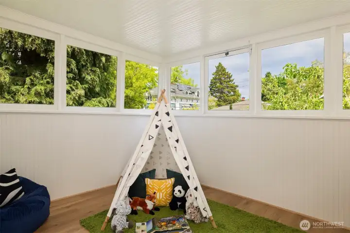 Sunroom staged as a play area