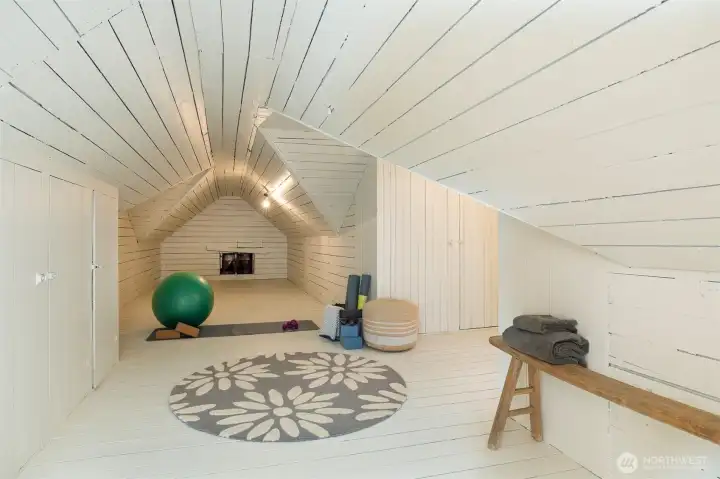Attic space staged as a yoga studio also has plenty of closets, including a rare cedar closet