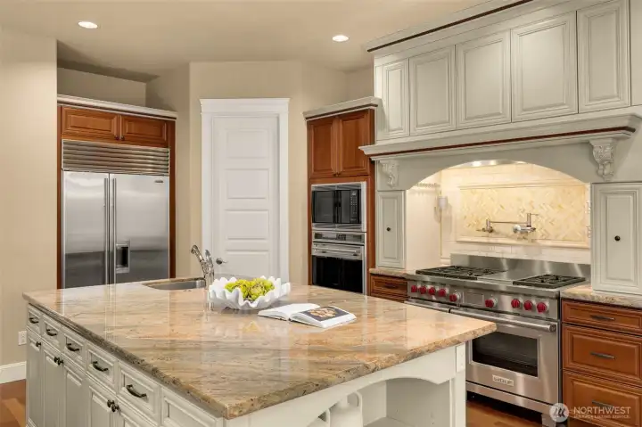 Large central island, sub zero fridge/freezer and Wolf double wall oven and range making carefree meals and entertaining