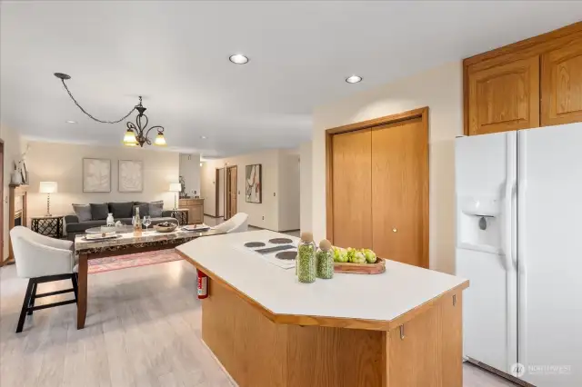 View from kitchen to casual dining space and living space.