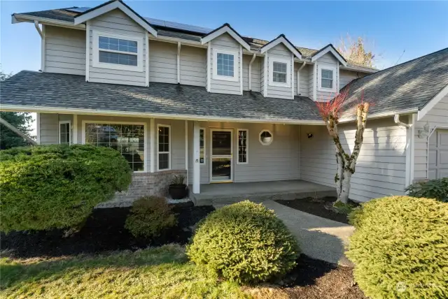 Front view of this 1 owner craftsman home with updated landscaping covered patio new ext paint and newer roof ready for all your needs