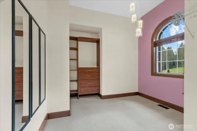 110 sf master bedroom walk in closet. This closet is unique in it has a large picture window, heat and LED designer pendant lighting.