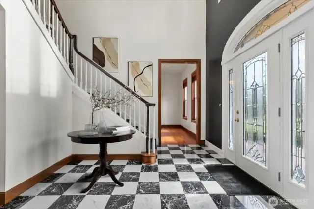 Virtually staged. The elegant black and white marble floors are wired to be heated.