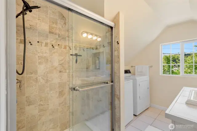 Three quarter bath with tiled shower.