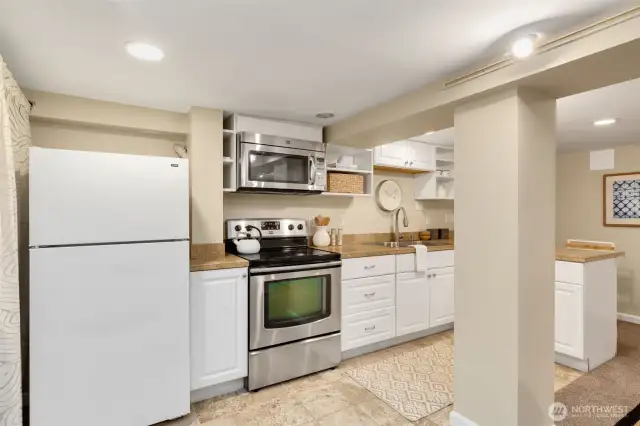 Full kitchen. Washer and dryer to left of fridge. Mini split for comfortable living.