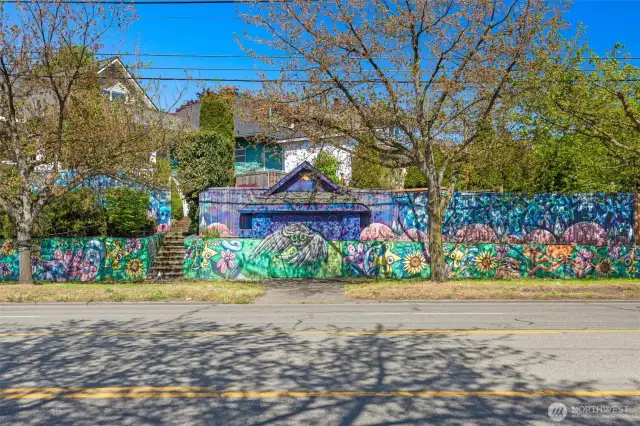 This shows off the full breadth of the mural by HENRY, Seattle’s Whimsical Mural Master!