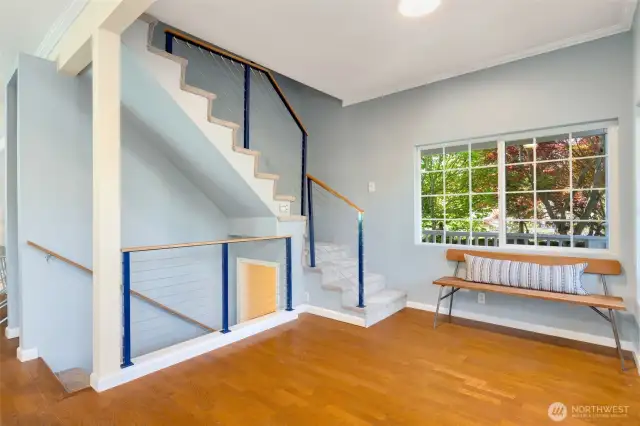 Roomy entry way! Stairs go down to lower level MIL style apartment. And up the stairs to 2 upper bedrooms, and 3/4 bath with laundry